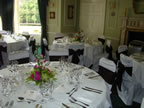 White Chair Covers and Chocolate Taffeta Sash